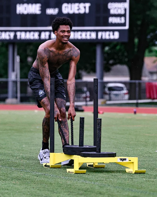Dink Pate pulling a weighted sled
