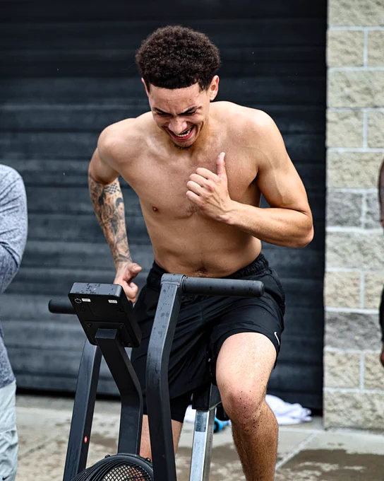 Miles Byrd on a stationary bike