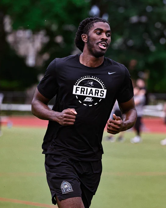 Samson Aletan running during an outdoor workout