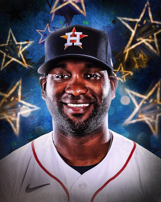 Stars appear behind Yordan Alvarez who wears a home white Houston Astros uniform and dark blue Houston Astros cap.