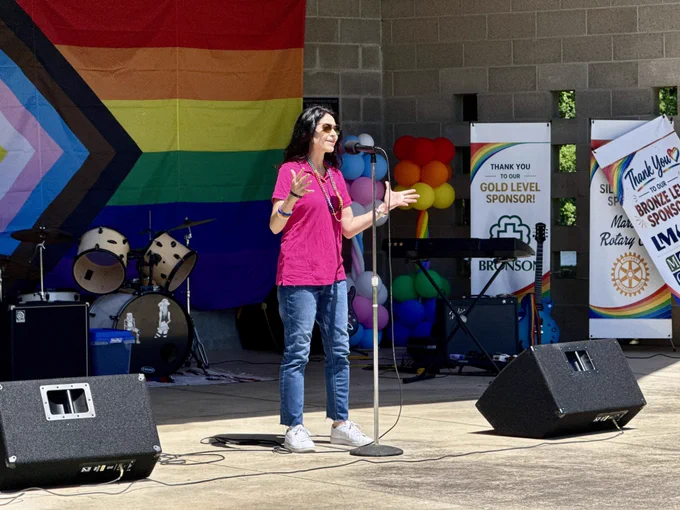 AG Nessel speaks into mic at Marshall Pride