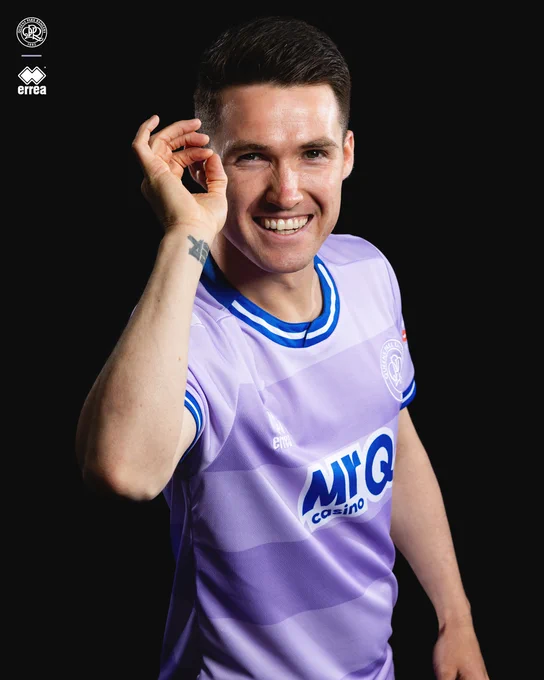 Paul Smyth modelling QPR’s new 2026/27 away shirt. 