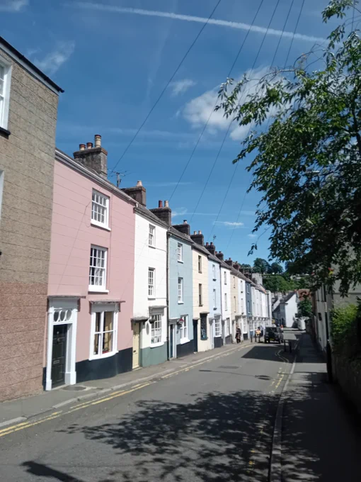 A row of neapolitan ice cream painted Georgian houses in a single line.