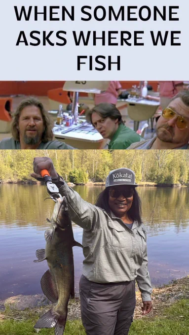 A woman holding a catfish