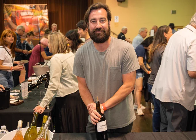 Man holding bottle of wine