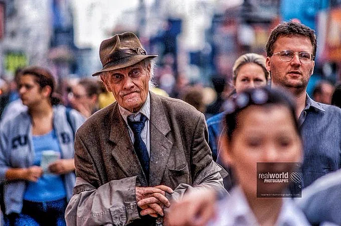 An old man blends in with the crowd in Central London, England. Gary Moore photo. Real World Photographs. #London #streetphotography  #Grok #photojournalism #England #Nikon #film #nineties #UK #LDN #Europe #UnitedKingdom  #garymoorephotography #realworldphotographs