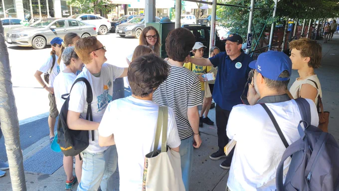 Speaking with a group of canvassers.