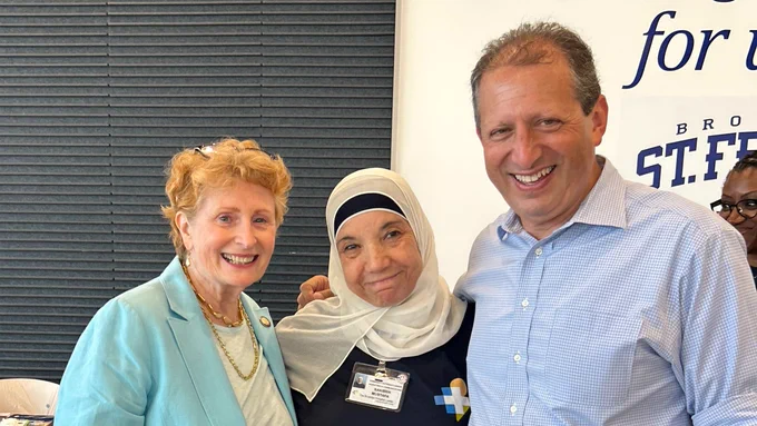 Standing with Jo Anne Simon and a neighbor.