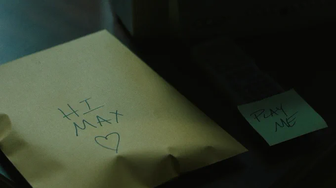 From Cape Fear. A closeup of the manila envelope that says, “Hi Max” with a heart underneath is pictured.