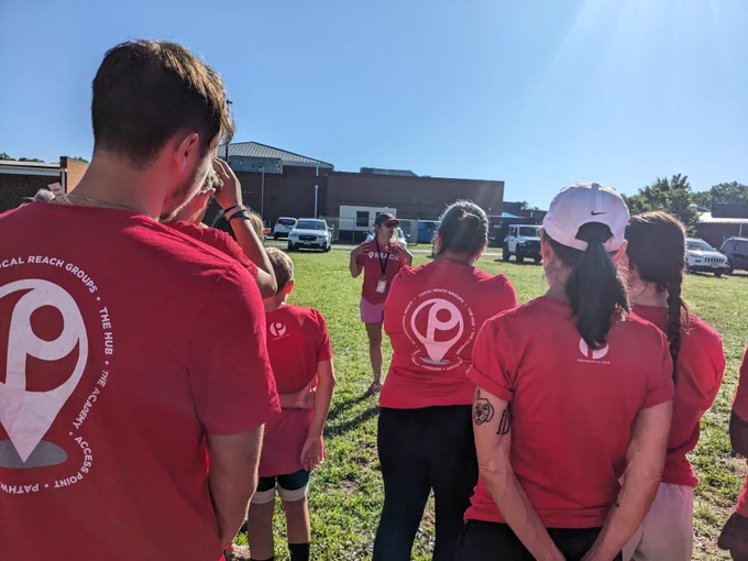 Meet up in our red shirts at a school campus 