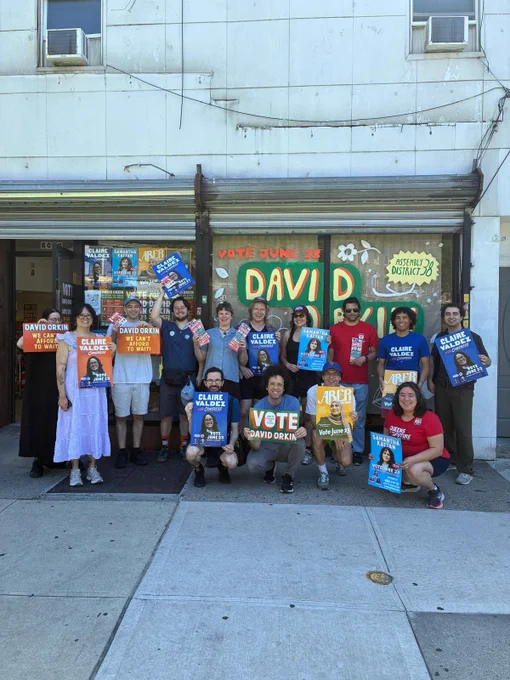 David Orkin for Queens volunteers posing in front of the campaign office for an Early Voting canvass group photo.