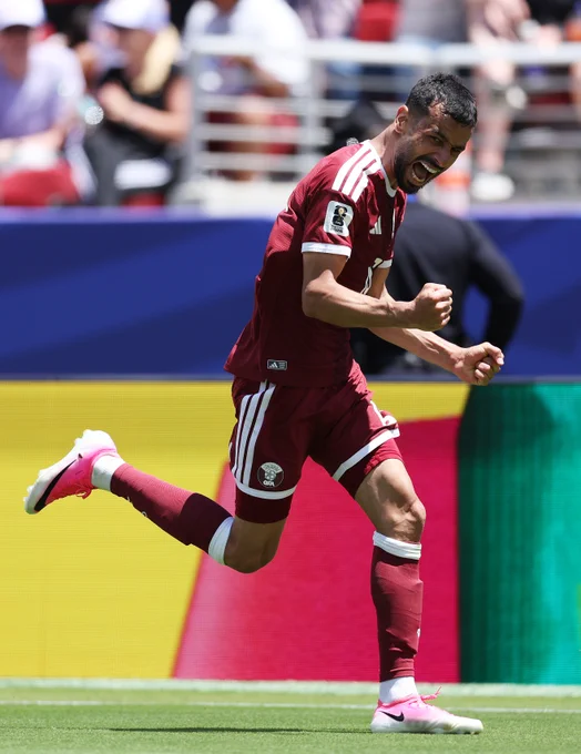 Boualem Khoukhi of Qatar celebrates scoring his team's first goal during the FIFA World Cup 2026 Group B match between Qatar and Switzerland