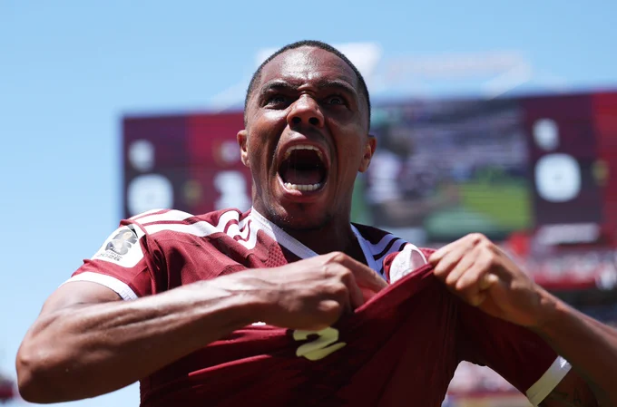 Pedro Miguel of Qatar celebrates the team's first goal by Boualem Khoukhi during the FIFA World Cup 2026 Group B match between Qatar and Switzerland