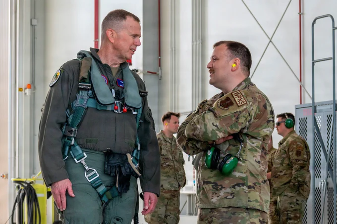 Gen. Gregory Guillot, commander, North American Aerospace Defense Command and U.S. Northern Command, and Master Sgt. Andrew Sabo, an alert crew supervisor, assigned to the Ohio National Guard's 180th Fighter Wing, discuss the aerospace control alert mission, prior to take-off, in Swanton, Ohio, June 11, 2026. As part of the NORAD enterprise, the 180th FW plays a pivotal role in providing aerospace control for continental defense. (U.S. Air National Guard photo by Senior Airman Camren Ray)