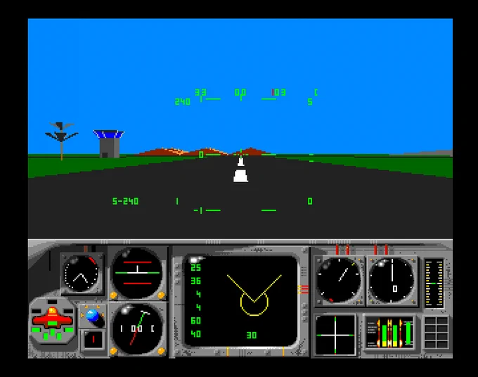 The cockpit view displays a runway ahead, with a control tower and mountains in the background under a clear blue sky.