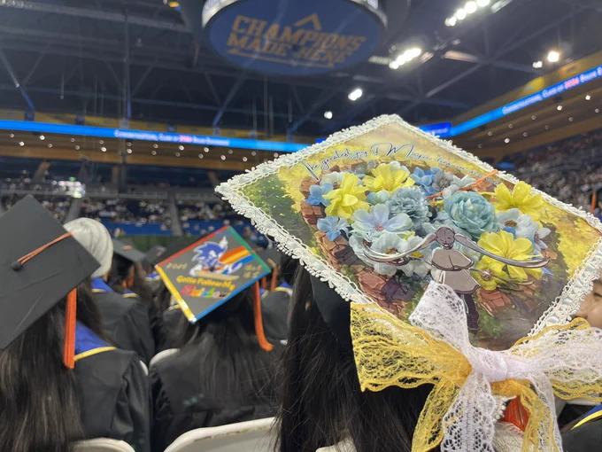 A cap decorated with blue and gold flowers