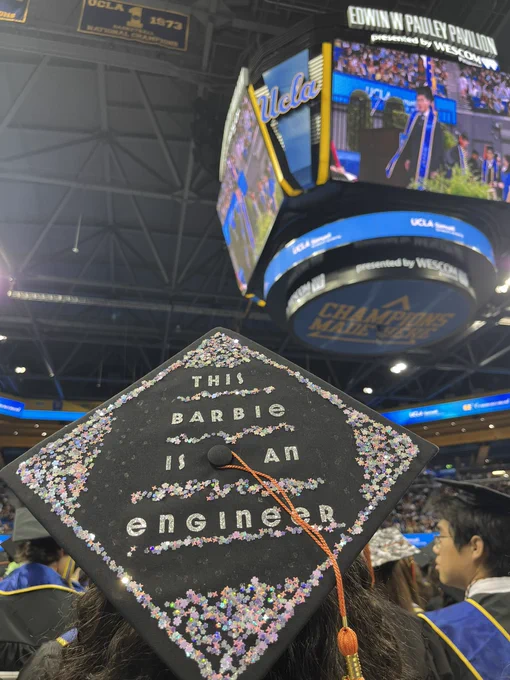 A decorated cap that says “this Barbie is an engineer”
