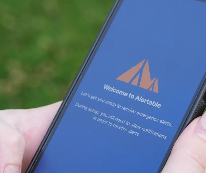 A close up of the alertable app opening up on a phone. 