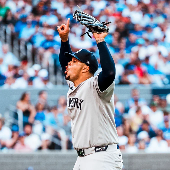 Fernando Cruz celebrates after getting through a bases-loaded jam.