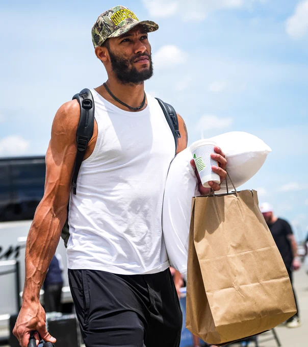 Photo of K'Andre Miller walking to the plane 