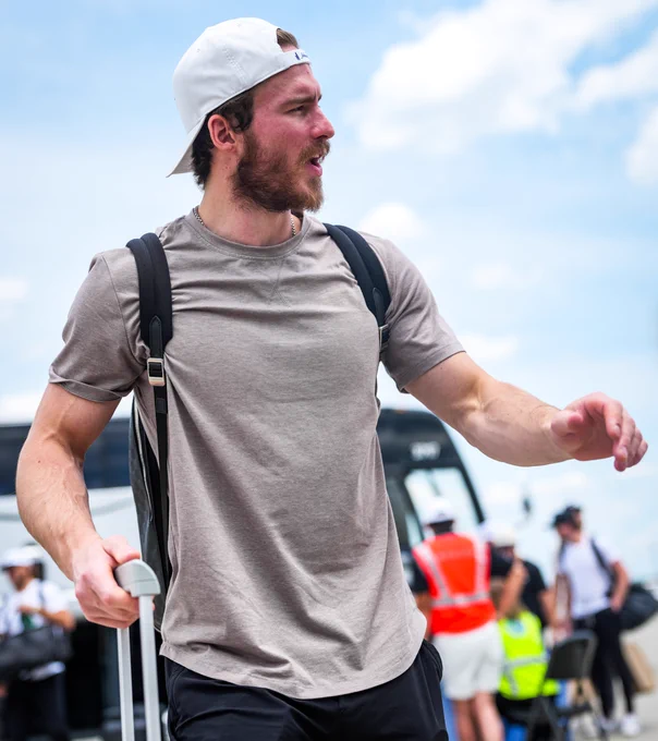 Photo of Andrei Svechnikov walking to the plane 