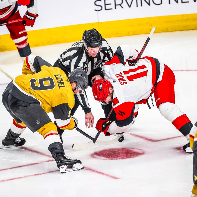 Photo of Jordan Staal winning a faceoff against the Knights 