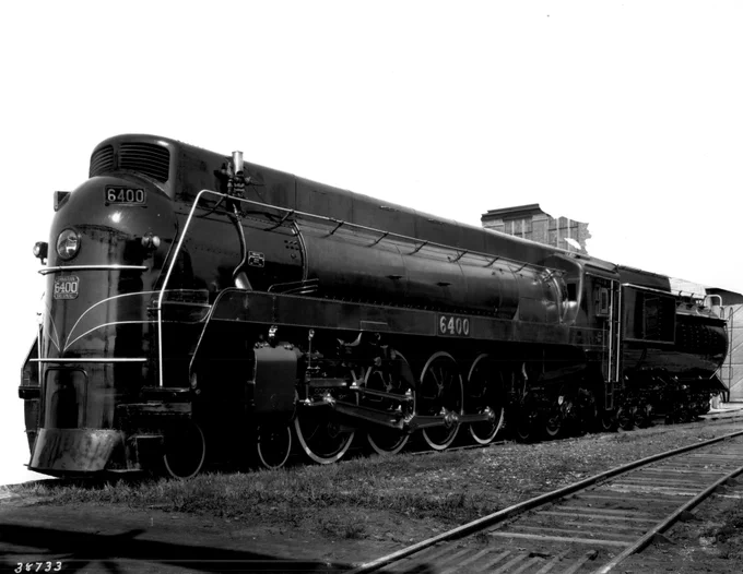 A 1936 promotional photo of brand-new Canadian National Railway streamlined U-4-a class 4-8-4 Northern type steam locomotive No. 6400, with the background almost entirely blanked out. CN Images of Canada Collection, Ingenium Archives.