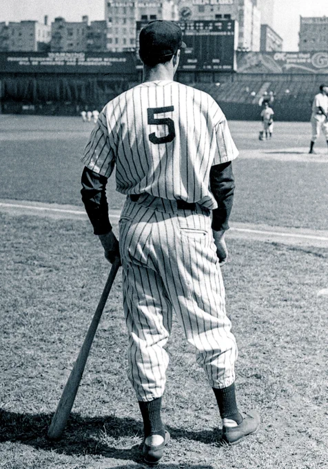Joe DiMaggio with his bat and Yankees Jersey No. 5 
