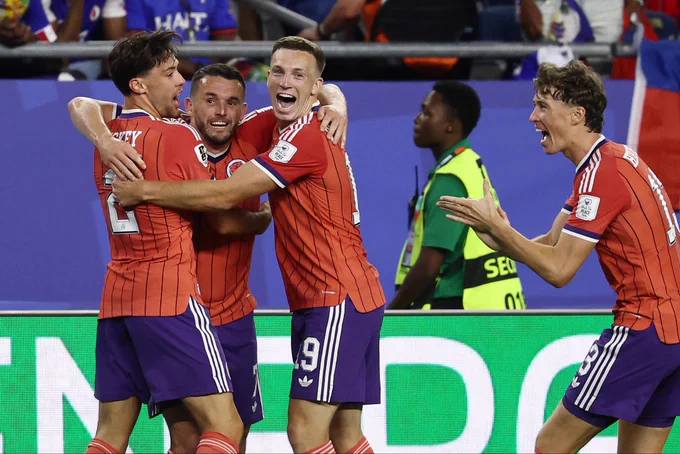 Scotland players celebrate after John McGinn’s goal against Haiti.