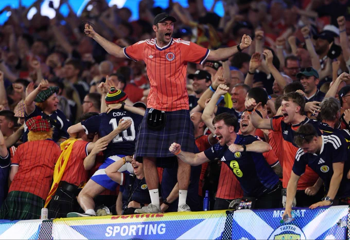 Fans celebrate in the stands after Scotland’s goal against Haiti.
