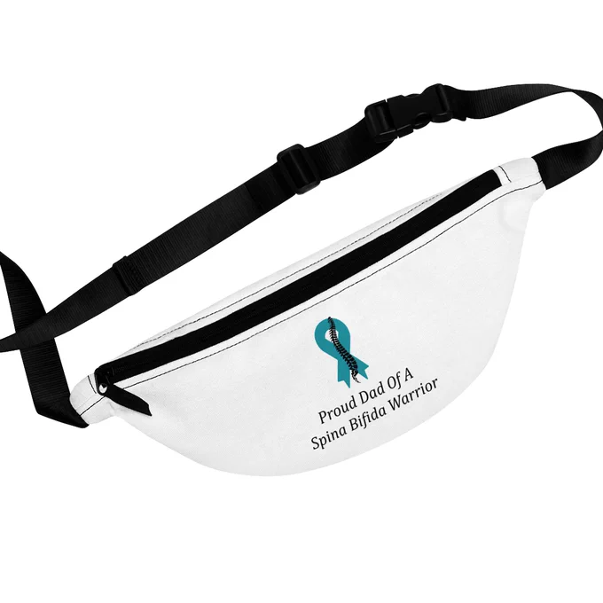 Proud Dad Of A Spina Bifida Warrior Fanny Pack with Adjustable Strap. The fanny pack is white with adjustable strap. There is a teal ribbon with a black spine running down the middle of the ribbon in the front of the fanny pack. There is text underneath the ribbon that says Proud Dad Of A Spina Bifida Warrior.