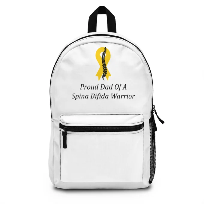 Proud Dad Of A Spina Bifida Warrior Backpack with Adjustable Straps. The backpack is white with adjustable straps. There is a yellow ribbon with a black spine running down the middle of the ribbon in the front top section of the backpack. There is text underneath the ribbon that says Proud Dad Of A Spina Bifida Warrior.