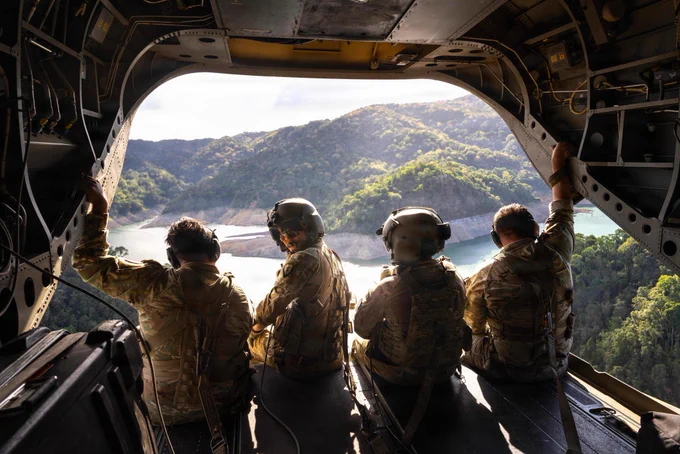 Task Force Saber Soldiers with 25th Combat Aviation Brigade took in the view from a CH-47 Chinook during a morale flight over the Philippines as part of Salaknib 26.