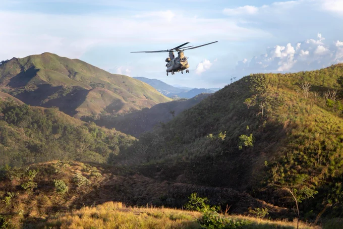 Task Force Saber Soldiers with 25th Combat Aviation Brigade took in the view from a CH-47 Chinook during a morale flight over the Philippines as part of Salaknib 26.