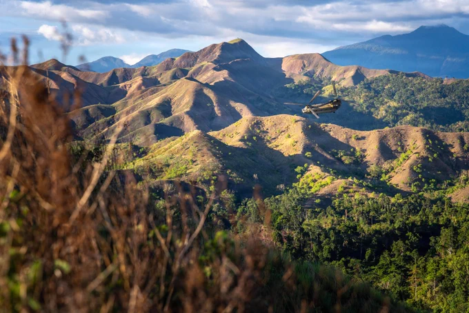 Task Force Saber Soldiers with 25th Combat Aviation Brigade took in the view from a CH-47 Chinook during a morale flight over the Philippines as part of Salaknib 26.
