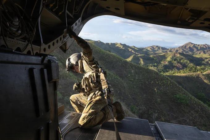 Task Force Saber Soldiers with 25th Combat Aviation Brigade took in the view from a CH-47 Chinook during a morale flight over the Philippines as part of Salaknib 26.