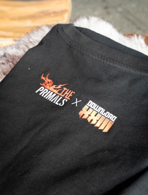 A photograph of the back of The Primals T-shirt at Download Festival 2026 showing both logos of The Primals and 23rd Download Festival.