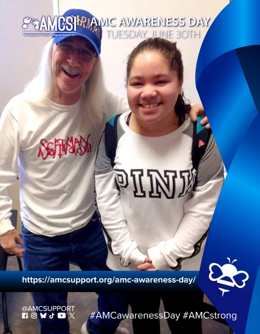 The AMCSI logo is small, white, in the upper-left corner & the background is a dark blue-to-blue circular gradient. It says ‘AMC AWARENESS DAY TUESDAY, JUNE 30TH’ in white, big lettering next to the AMCSI logo, with a photo of Samya, who is 24 now, and wanted to share one of her favorite moments meeting Ward "Scarman" Foley, with a large blue ribbon on the right with the white bumblebee on the bottom left corner of it. Near the bottom is a blue-to-dark-blue gradient bar that runs behind the ribbon on the right & all the entire width, with the AMC Awareness Day AMCSI website link "https://amcsupport.org/amc-awareness-day/" in bold white lettering across it. At the bottom right are the logos of Facebook, Instagram, BlueSky, TikTok, YouTube, and X. The text "@AMCSUPPORT" is located above them, on the bottom left, and the hashtags “#AMCawareness” & “#AMCstrong” are displayed on the bottom right, all in white.

#AMCCommunity
#ArthrogryposisMultiplexCongenita
#RareCondition