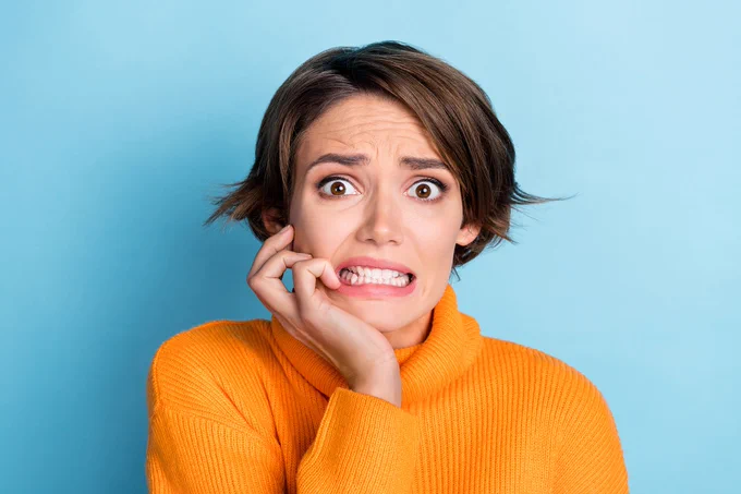 Young woman looking anxious.