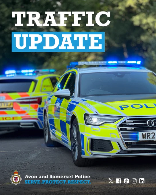 Avon and Somerset Police cars with blue lights flashing, announcing a traffic update.