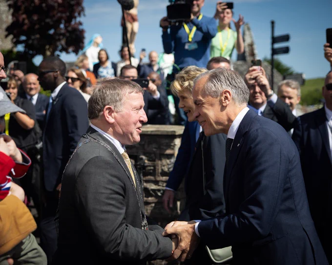 Prime Minister Carney meets and shakes hands with members of the community in County Mayo, Ireland.