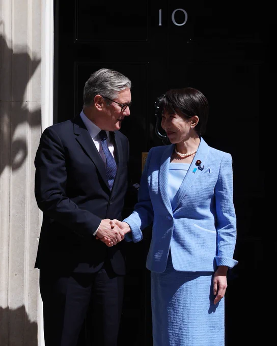 Prime Minister Keir Starmer shakes the hand of Sanae Takaichi the Prime Minister of Japan on the steps of 10 Downing Street.