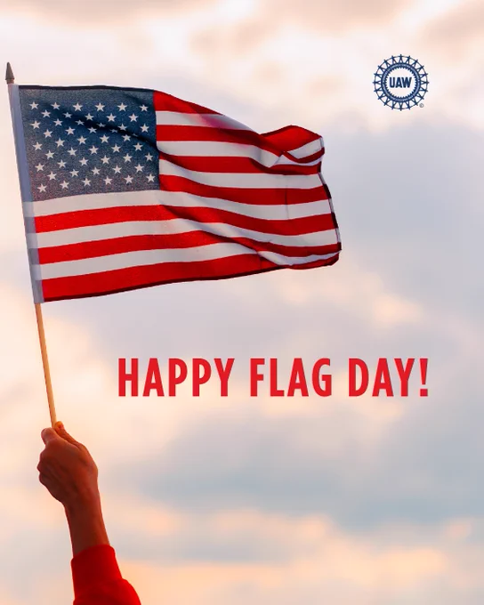 Photo of a hand holding the U.S. flag with the words "Happy Flag Day" in red and the UAW wheel logo in blue.