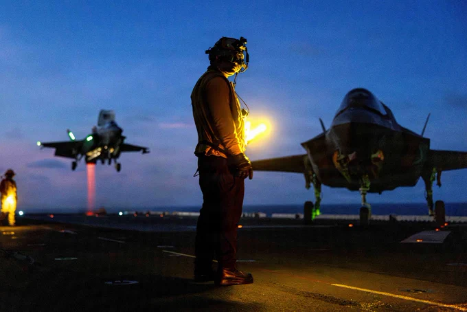 A U.S. Sailor assigned to Wasp-class amphibious assault ship USS Boxer (LHD 4) stands on the flight deck during flight operations in the South China Sea, June 8, 2026. The 11th MEU, embarked aboard the Boxer Amphibious Ready Group, is a persistent, combat credible force contributing to deterrence and crisis response in the U.S. 7th Fleet area of operations. U.S. 7th Fleet, the U.S. Navy's largest forward-deployed numbered fleet, routinely interacts and operates with allies and partners to preserve a free and open Indo-Pacific. (U.S. Marine Corps photo by Sgt. Trent A. Henry)
