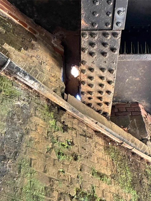 An image of a sinkhole which has appeared on a bridge in the Purley area.