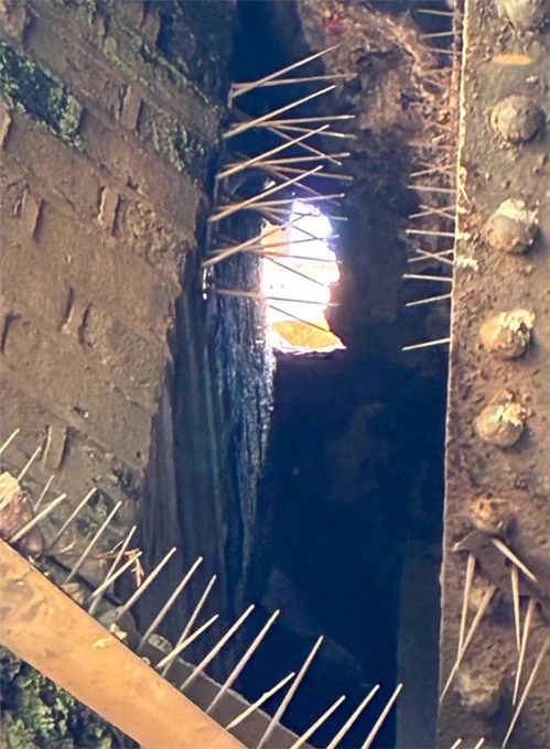 An image of a sinkhole which has appeared on a bridge in the Purley area.