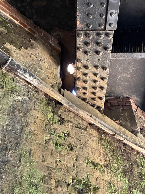 View from below the bridge where a hole has formed