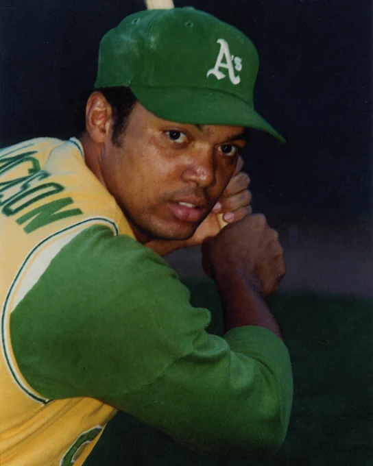 Batting portrait of Reggie Jackson wearing a green Athletics cap and gold jersey. (Doug McWilliams/National Baseball Hall of Fame and Museum)