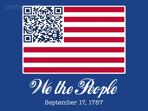 Graphic design on a dark blue background featuring a stylized United States flag. In the upper-left canton, where the stars usually sit, there is a large blue and white QR code. The flag retains its traditional alternating red and white horizontal stripes. Below the flag, the phrase "We the People" is written in a white, elegant cursive script, with the date "September 17, 1787" printed in a simpler white serif font directly beneath it. A faint watermark text is visible in the top left corner, for shirt.woot.com