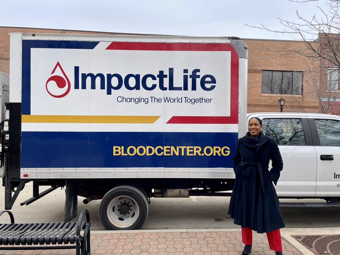 Lt. Governor Juliana Stratton stands outside the Impact Life Blood Donation truck.